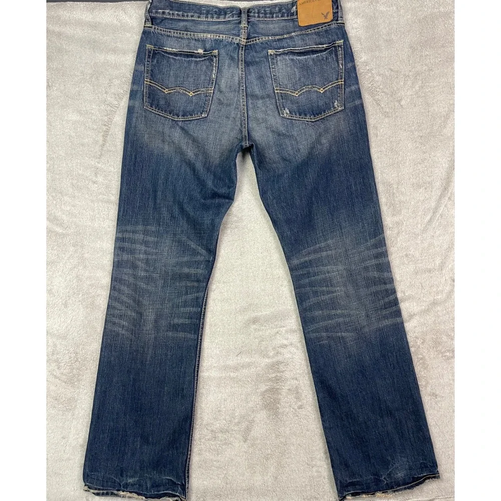 American Eagle Jeans Men Size 34 Low Rise Boot Cut Blue Denim Distressed Casual